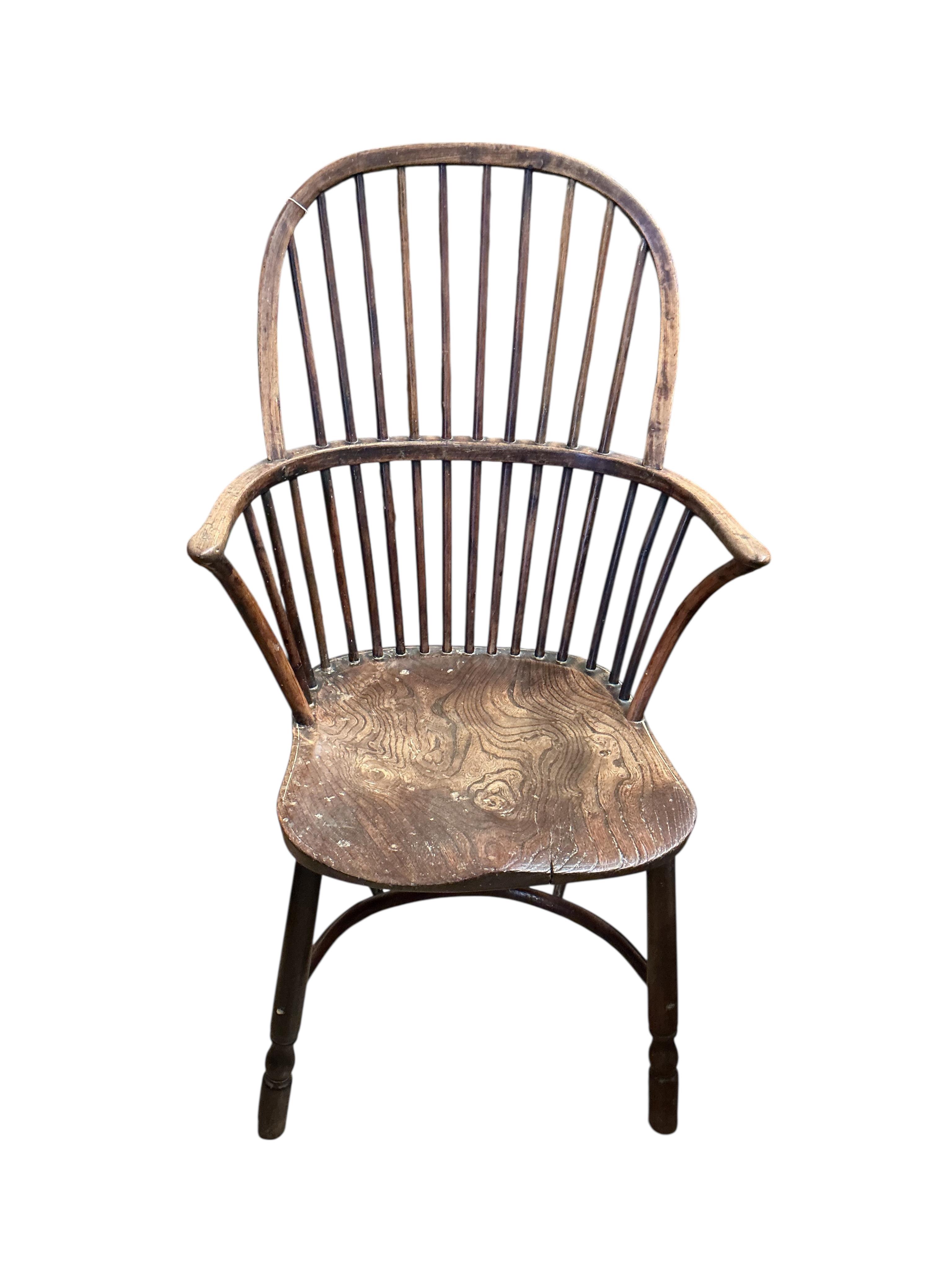 A 19th century ash, elm and beech Windsor comb back with crinoline stretcher armchair, width 57cm, depth 43cm, height 102cm